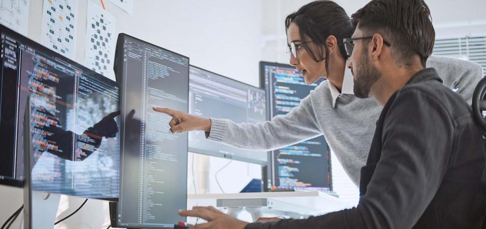 two people in front of a computer 